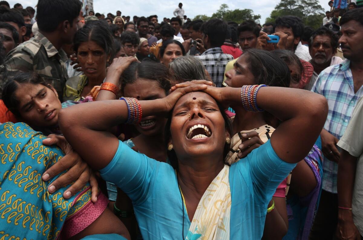 A relative of a victim cries at the site of the crash in the Medak district in the southern Indian state of Telengana on Thursday.