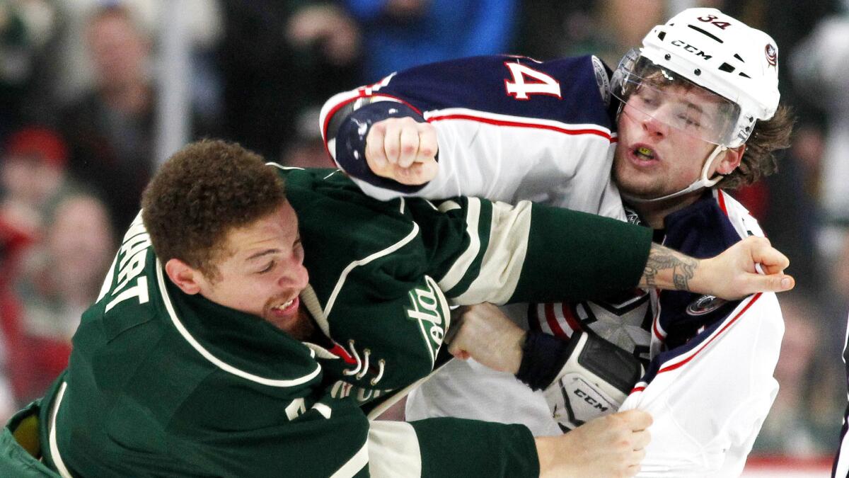 Minnesota Wild right wing Chris Stewart, left, and Columbus Blue Jackets right wing Josh Anderson square off during the second period of a game Saturday.