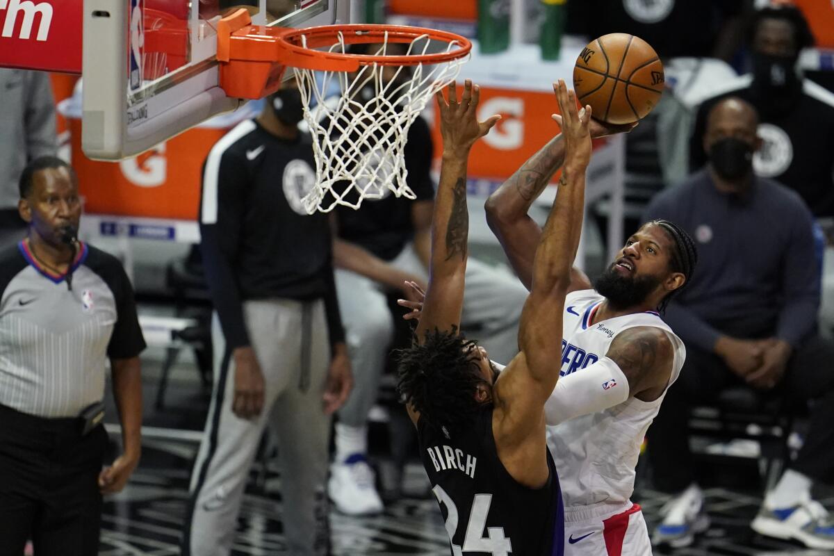 Paul George shoots over Toronto's Khem Birch during a game earlier this month.