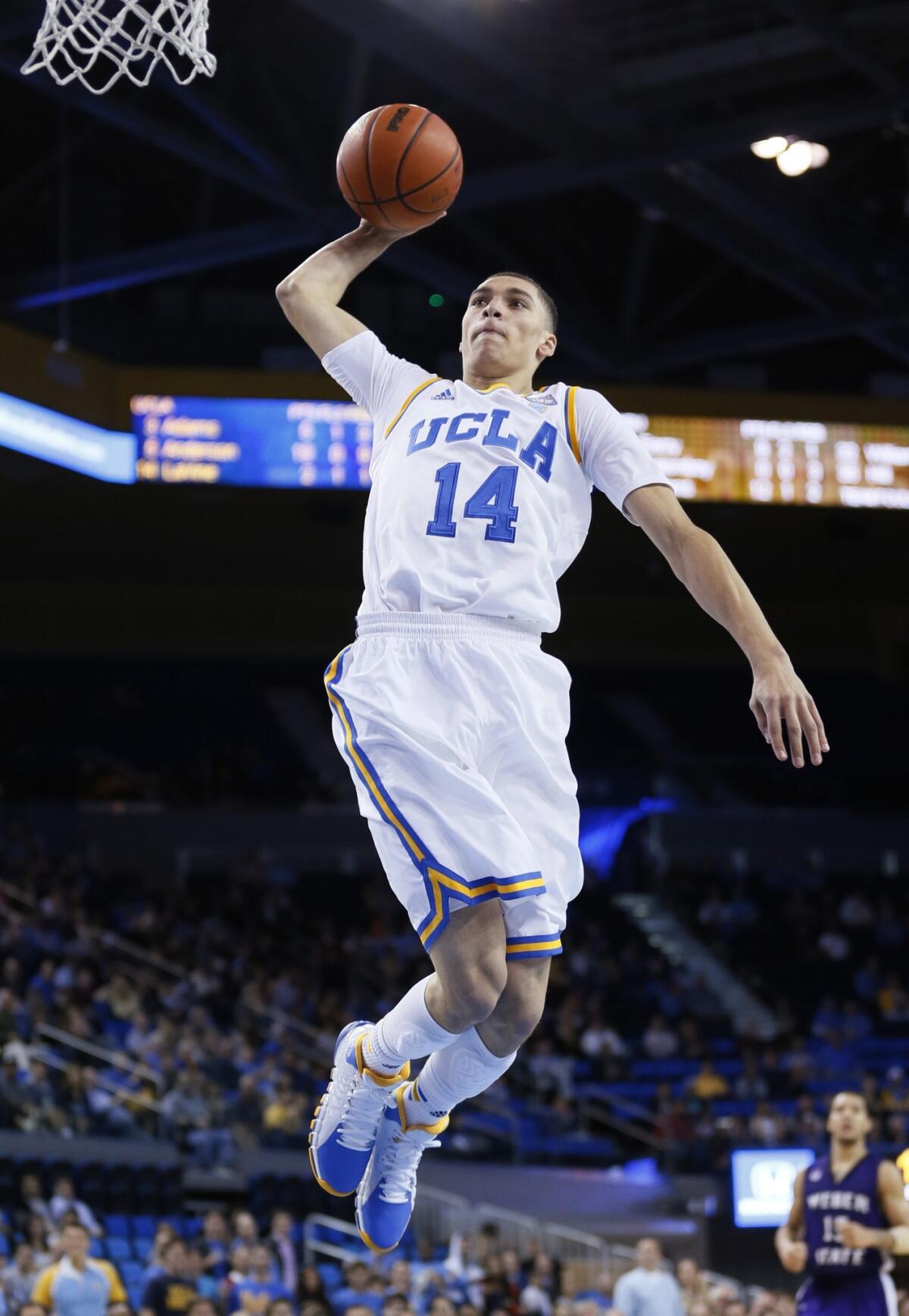 UCLA's Zach LaVine dunks during the Bruins' 83-60 win over Weber State on Sunday.