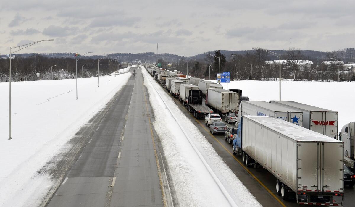 Nearly 2 feet of snow fell in Kentucky the last two days, prompting the closure of a stretch of Interstate 65.
