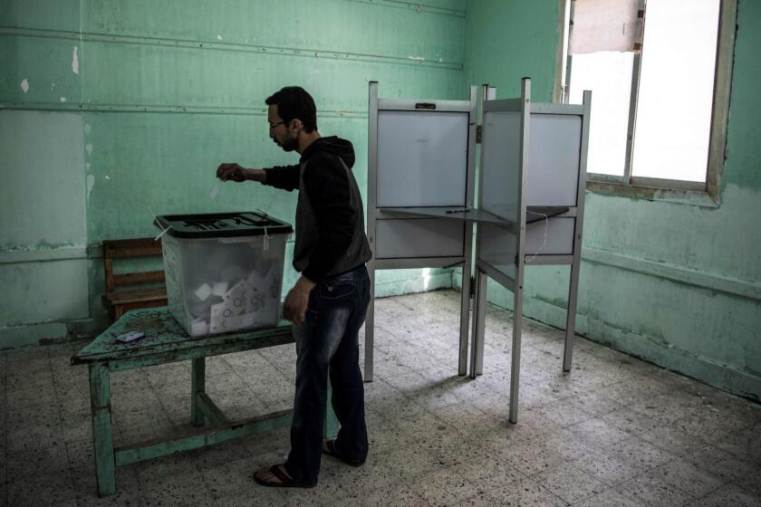 TOPSHOT - An Egyptian man casts his vote in a polling station during the third day of a referendum on constitutional amendments in Cairo on April 22, 2019. - Egyptians voted for a third and final day Monday on constitutional changes that could keep President Abdel Fattah al-Sisi in power until 2030, amid reports of people actively being encouraged to go the polls. (Photo by Khaled DESOUKI / AFP)KHALED DESOUKI/AFP/Getty Images ** OUTS - ELSENT, FPG, CM - OUTS * NM, PH, VA if sourced by CT, LA or MoD **