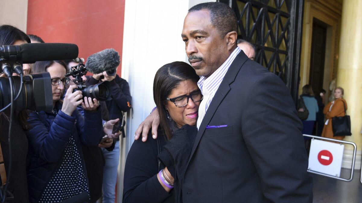 Phil and Jill Henderson, parents of Bakari Henderson of Austin, Texas, face the media outside the courthouse in Patras, Greece, on Thursday. A Greek court on Thursday convicted and sentenced six of nine suspects in the fatal beating of their 22-year-old son.