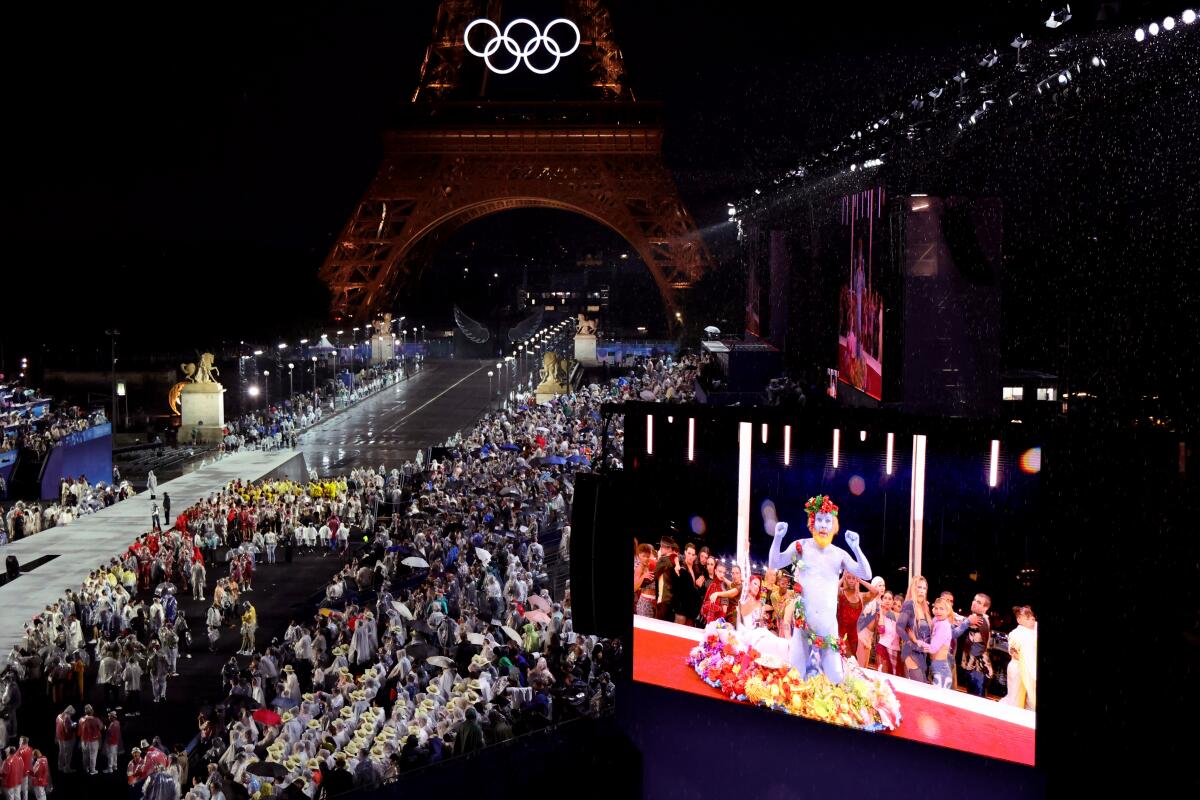 French singer Philippe Katerine performs on a giant screen in Paris