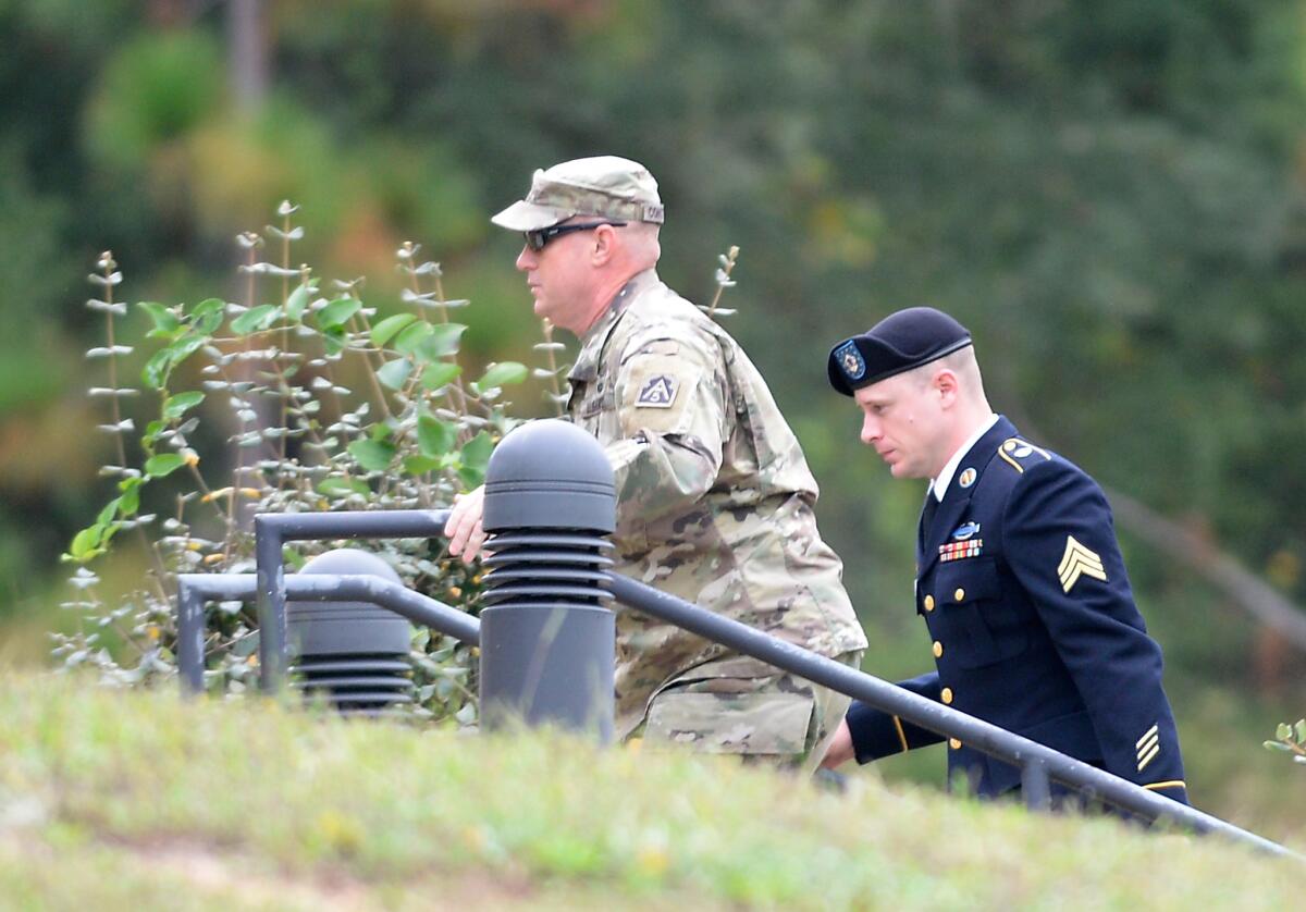 Sgt. Bowe Bergdahl, right, arrives for a motions hearing at Fort Bragg, N.C. on Monday, Oct. 16.