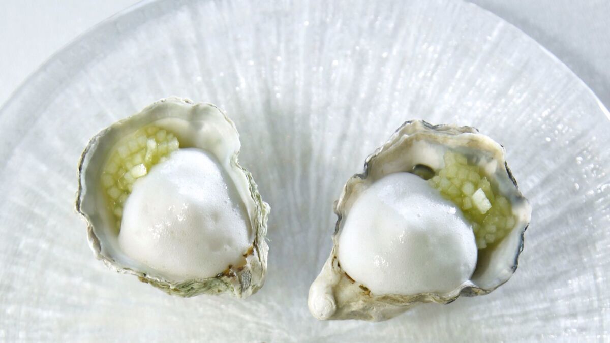 Kumomoto Oyster with sorrel and horseradish mousseline by chef William Bradley at Addison at the Grand Del Mar.
