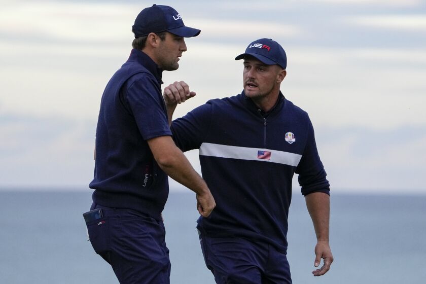 The United States' Bryson DeChambeau, right, and Scottie Scheffler at the Ryder Cup on Sept. 25, 2021, in Sheboygan, Wis.