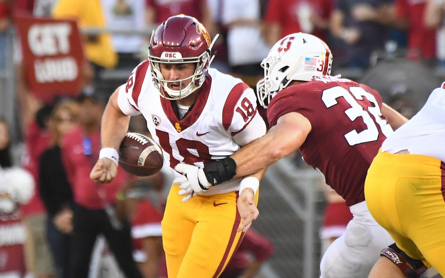USC quarterback J.T. Daniels is stripped of the ball by Stanford linebacker Joey Alfieri on 4th down in the 2nd quarter.