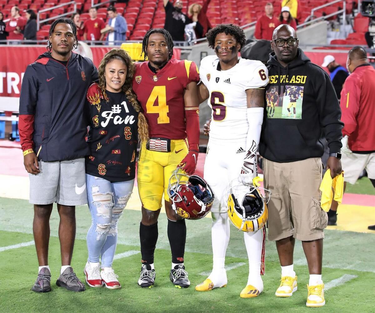 Brothers Max (No. 4) and Macen Williams (No. 6) are flanked by family members.
