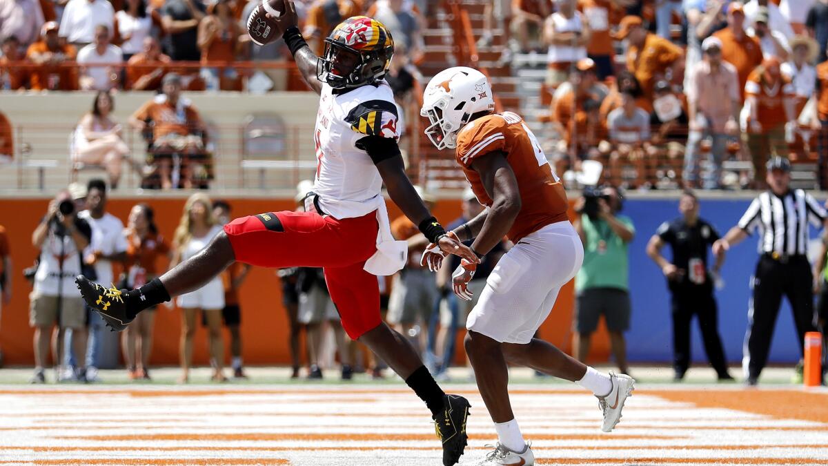Maryland quarterback Kasim Hill begins to celebrate after rushing for a touchdown against Texas in the fourth quarter Saturday.