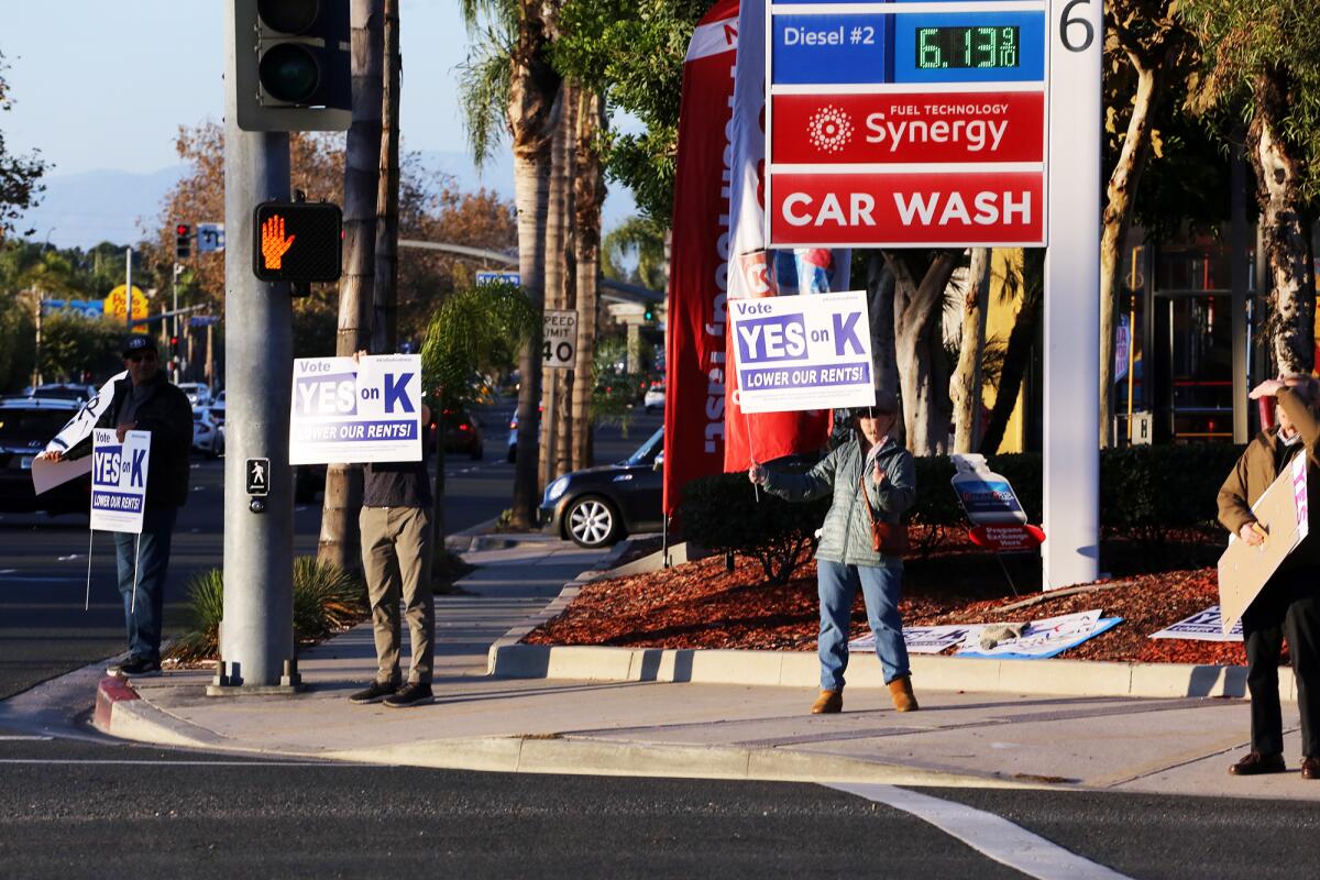 Costa Mesa residents rally in November in support of Measure K at the intersection of Harbor Boulevard and Baker Street. 