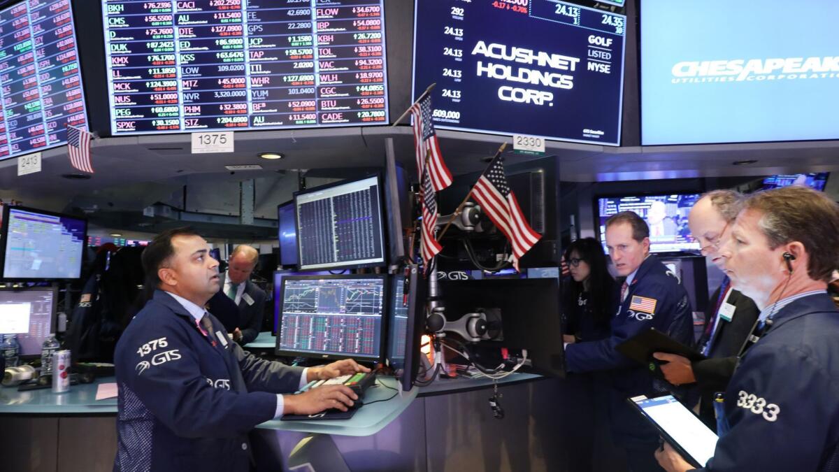 Traders work on the floor of the New York Stock Exchange on May 20.