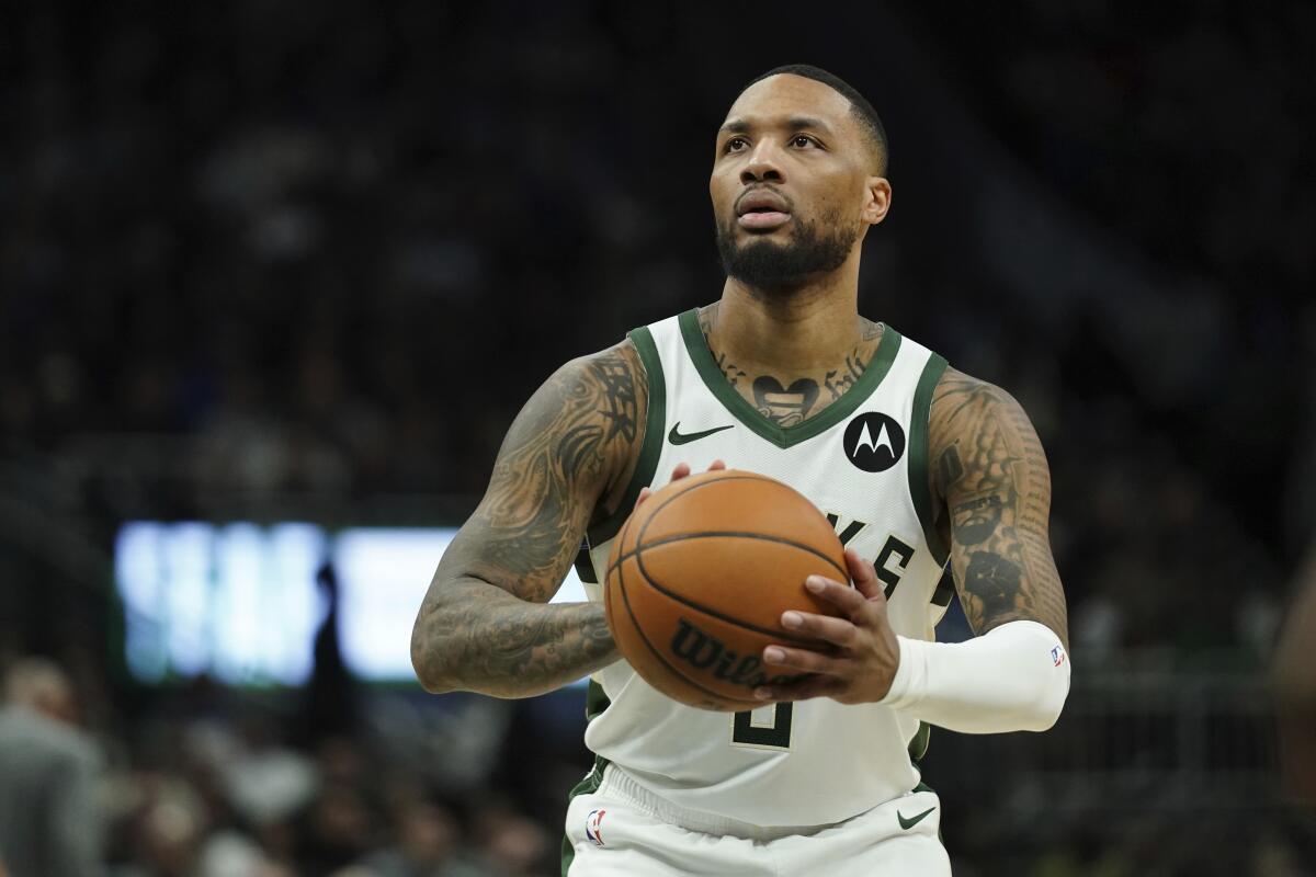 The Bucks' Damian Lillard shoots a free throw during a game against the Orlando Magic on March 8.