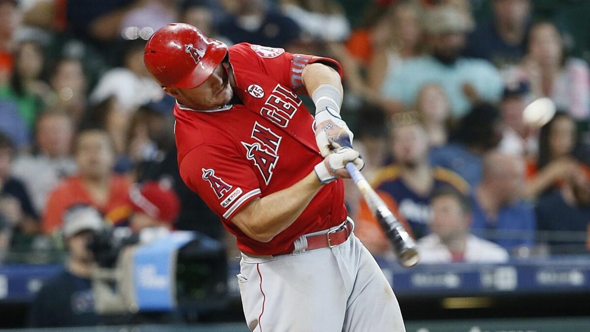 Angels slugger Mike Trout hits a two-run home run in the eighth inning Sunday.