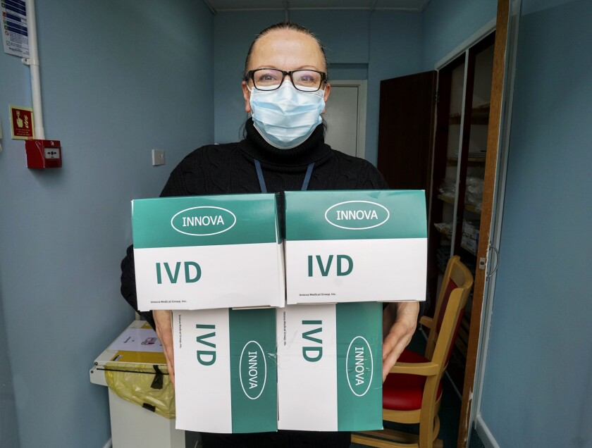 A worker holds boxes