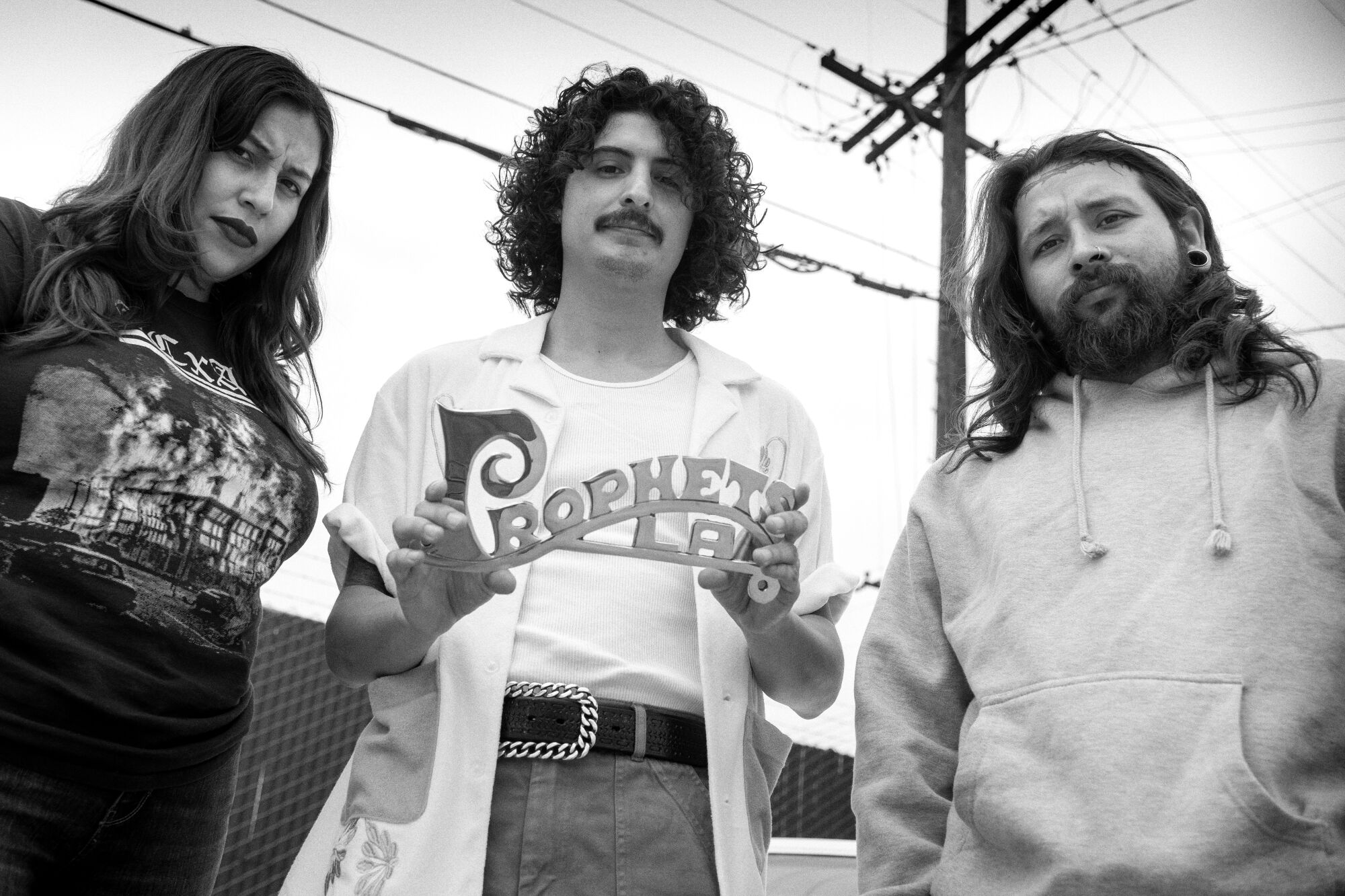 Photo of tattoo artist and designer Jesse Jaramilo with Prophets car club co-founders Mark Hocutt and Jacqueline Valenzuela.