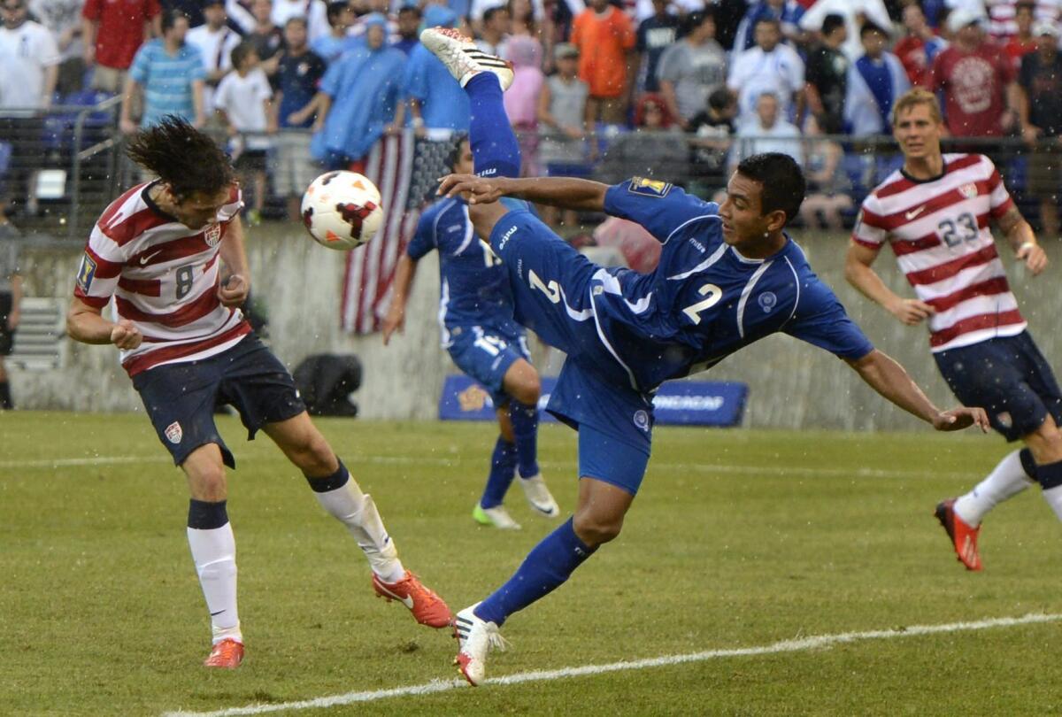 U.S. midfielder Mix Diskerud, left, heads the ball past El Salvador's Xavier Garcia for a score in the CONCACAF Gold Cup quarterfinal game last summer.