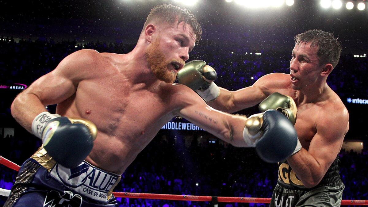 Canelo Alvarez, left, exchanges blows with Gennady Golovkin during their Sept. 16 fight at T-Mobile Arena in Las Vegas.