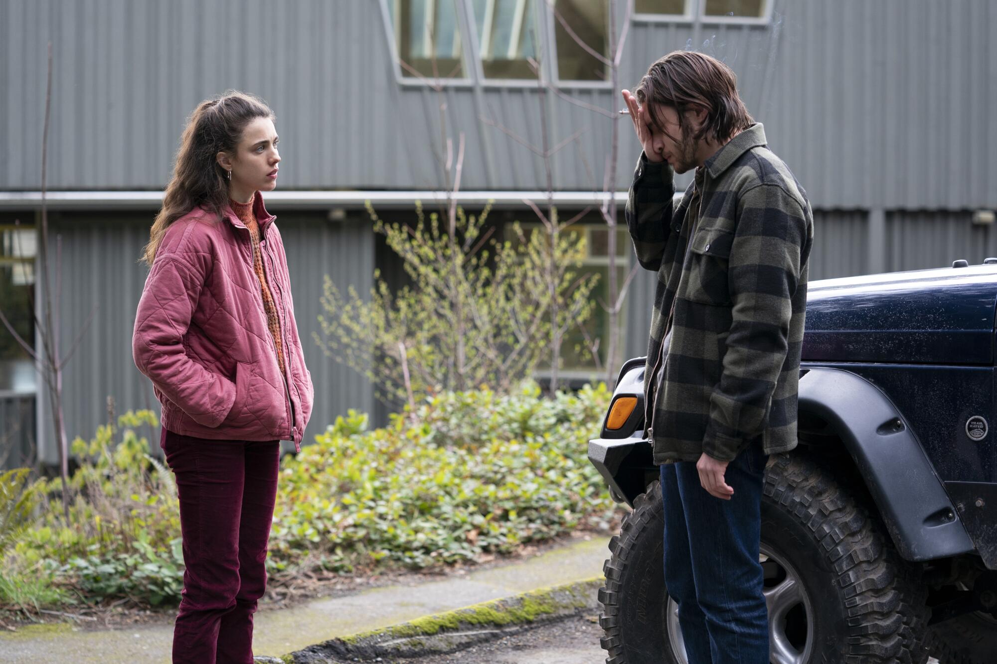 A man and woman look unhappily at each other in a scene from "Maid."