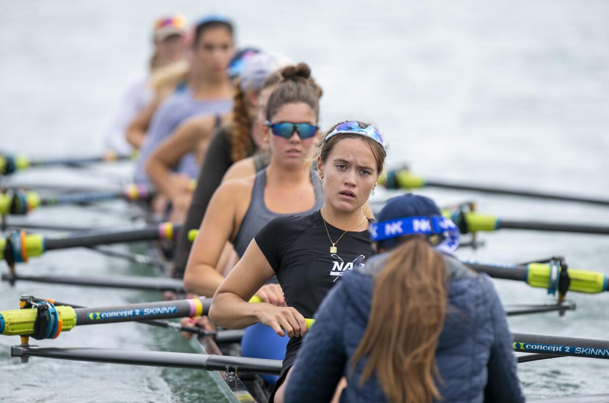 Corona del Mar's Kat Odeen, in front, a senior with the Newport Aquatic Center rowing program, practices on Wednesday.
