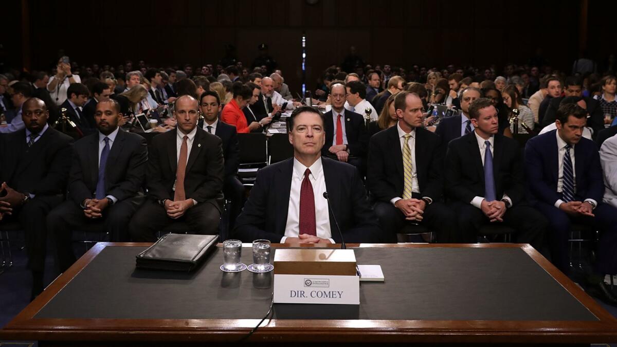 Former FBI Director James B. Comey testifies before the Senate Intelligence Committee on June 8, 2017, one month after being fired.