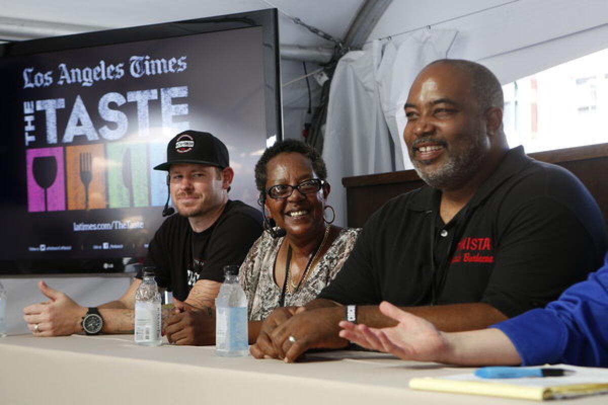 Ryan Chester of Smoqued BBQ, Sylvie Curry of the Lady of Q barbecue competition team and Neil Strawder of Bigmista's Barbecue discuss techniques.