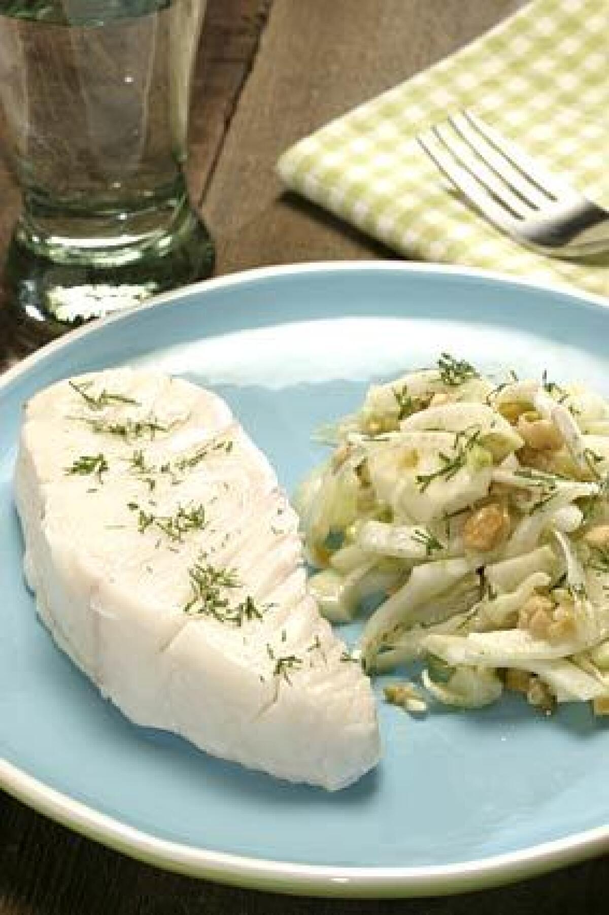 Cold-poached halibut pairs well with the crunch of a fennel, olives and walnut salad, tossed with olive oil and lemon juice.