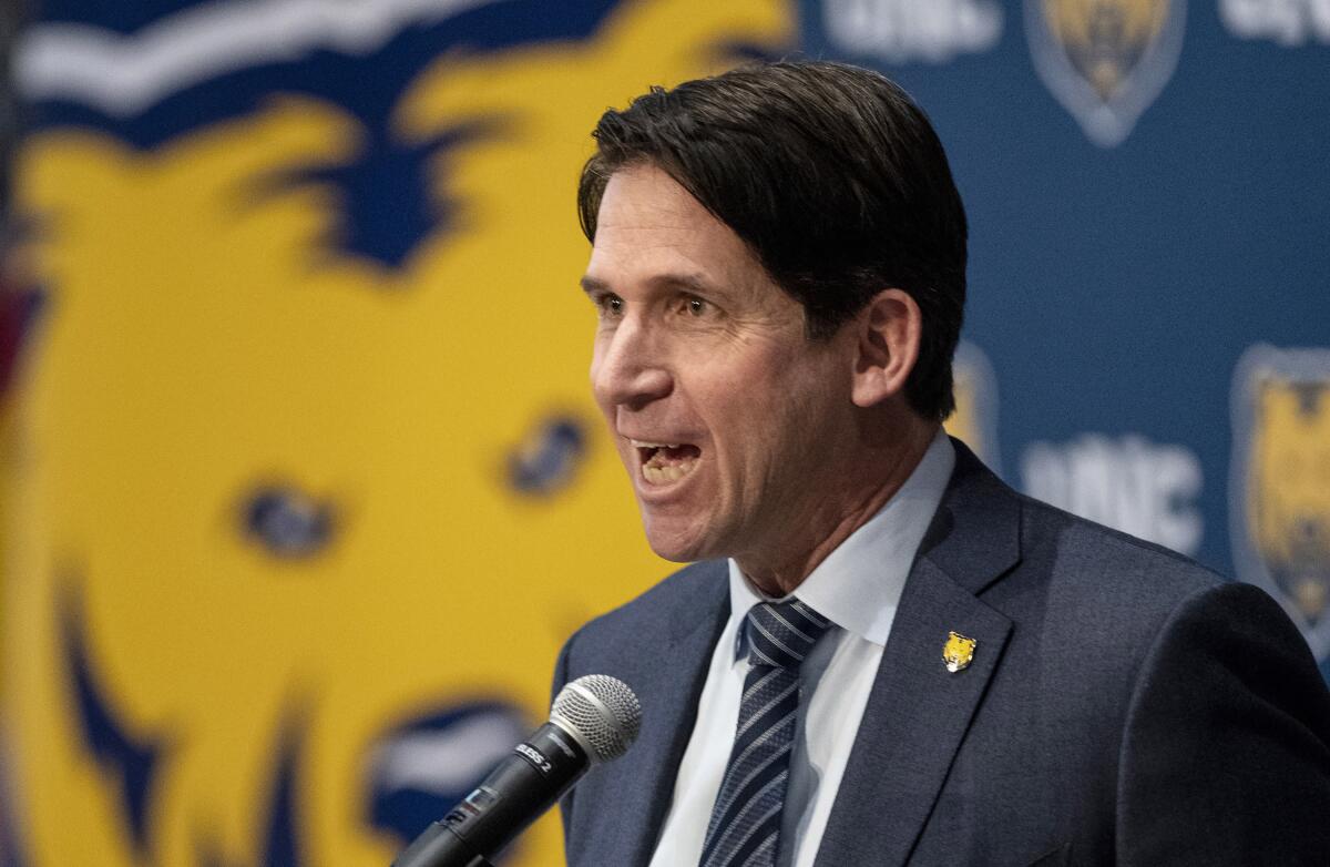FILE - In this Dec. 13, 2019, file photo, former NFL wide receiver Ed McCaffrey speaks during a news conference after being introduced as the new University of Northern Colorado head football coach in Greeley, Colo. McCaffrey will lead the Bears on to the gridiron to face Colorado in Boulder, Colo., for the two teams' season-opening tilt on Friday, Sept. 3. (Alex McIntyre/The Greeley Tribune via AP, File)