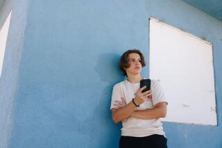 Sherman Oaks, CA - July 03: William Schnider, a 17-year-old at Van Nuys High School and a student in the medical magnet program, is against the cellphone ban at LAUSD schools, and here he poses for a portrait at Van Nuys Sherman Oaks Park on Wednesday, July 3, 2024 in Sherman Oaks, CA. (Dania Maxwell / Los Angeles Times)