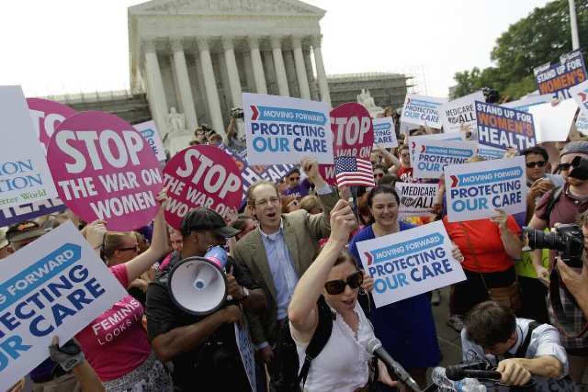 Supporters of the healthcare law celebrate outside the Supreme Court after the justices' ruling.
