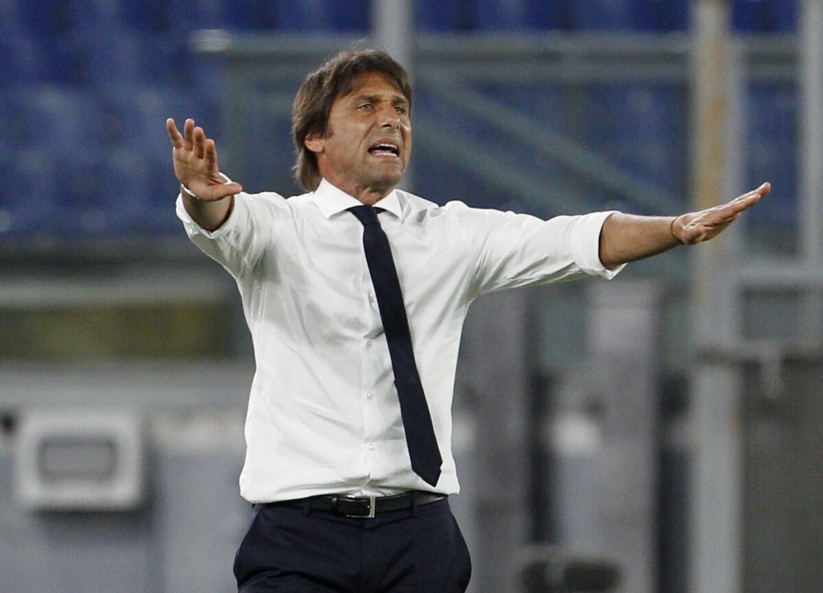 FILE - Inter Milan's head coach Antonio Conte gives instructions during the Serie A soccer match between Roma and Inter Milan, at the Rome Olympic Stadium, Sunday, July 19, 2020. (AP Photo/Riccardo De Luca, File)