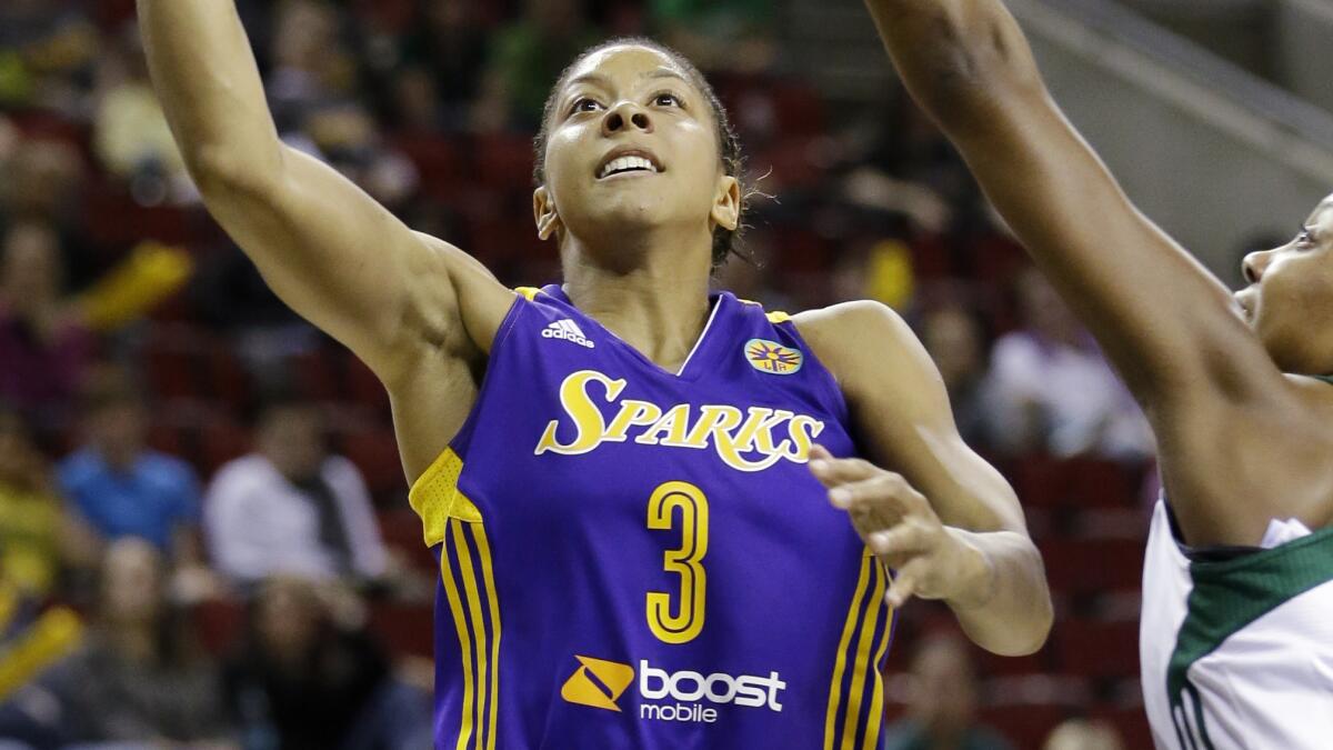 Sparks star Candace Parker puts up a shot during a game against the Seattle Storm in May. The Sparks play host to the Storm on Tuesday.