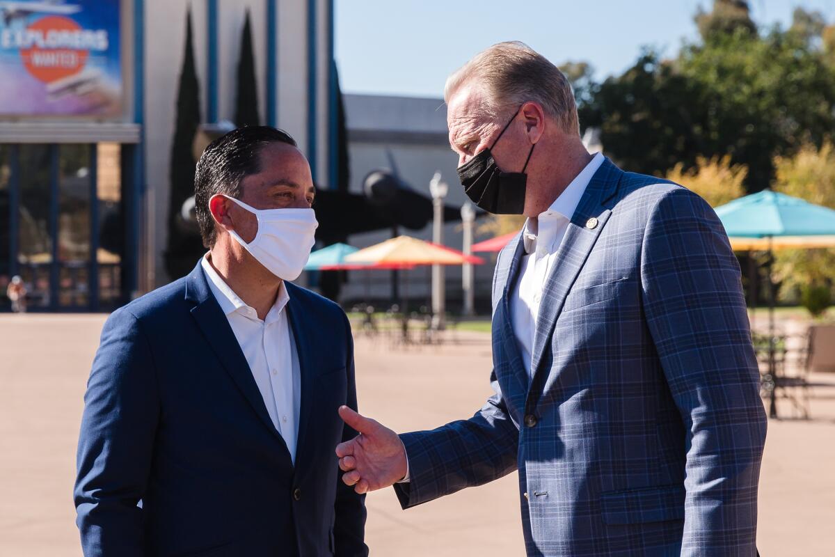 Former San Diego Mayor Kevin Faulconer (right) and newly minted Mayor Todd Gloria.