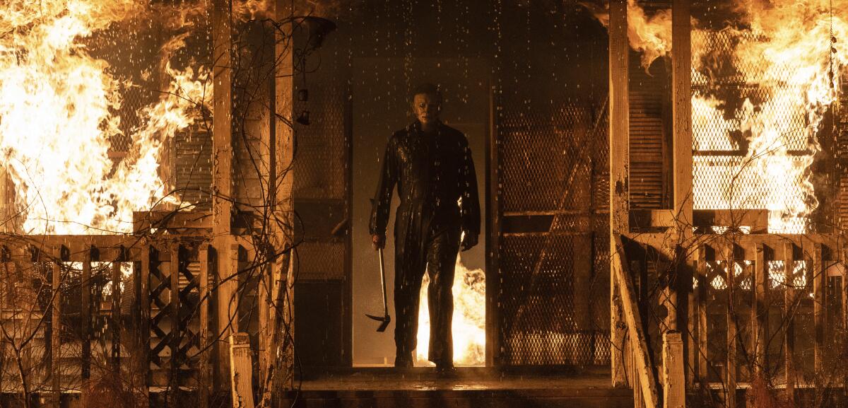 Michael Myers in "Halloween Kills" surrounded by flames