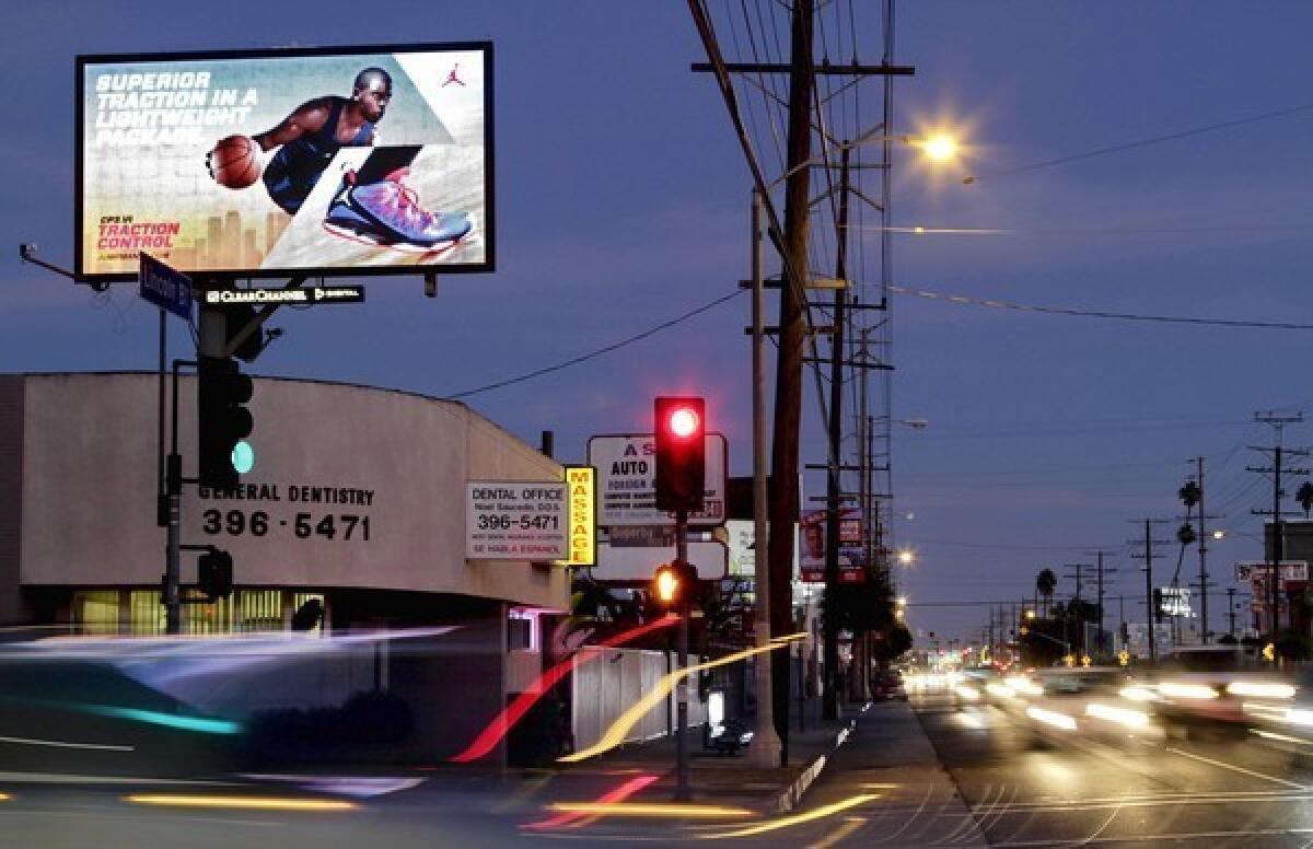 Neighborhood activists say digital billboards create blight and shine into yards and homes.