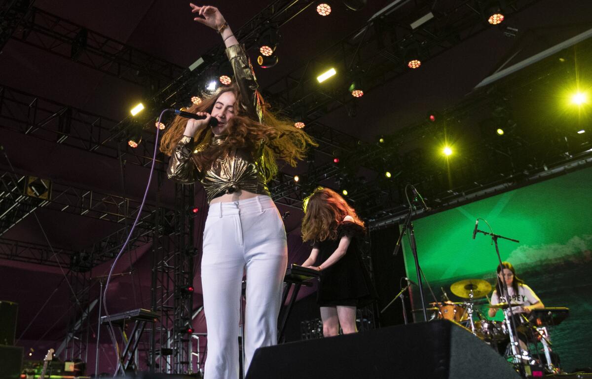 Let's Eat Grandma's Rosa Walton, left, and Jenny Hollingworth, on keyboard, center, onstage during Day 1 at the Coachella Valley Music and Arts Festival. (Brian van der Brug / Los Angeles Times)