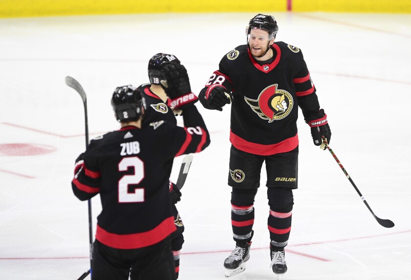 Ottawa Senators' Connor Brown, right, celebrates a goal with teammates against the Montreal Canadiens during the third period of an NHL hockey game, Wednesday, May 5, 2021 in Ottawa, Ontario. (Sean Kilpatrick/The Canadian Press via AP)