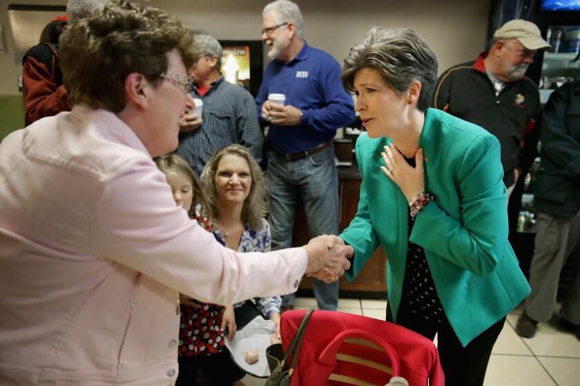 Republican U.S. Senate candidate Joni Ernst greets supporters at CJ's Bagel Basket Nov. 3 in Ankeny, Iowa.