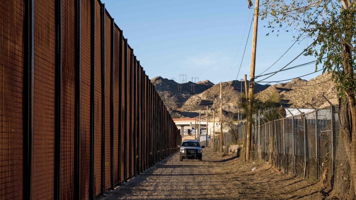 In this photo taken Dec. 23, 2018, a Border Patrol officer makes his rounds near central El Paso.