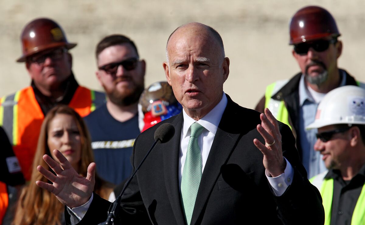Gov. Jerry Brown speaks at a 2015 groundbreaking ceremony for the bullet train in Fresno. The project counts on cap-and-trade funding.