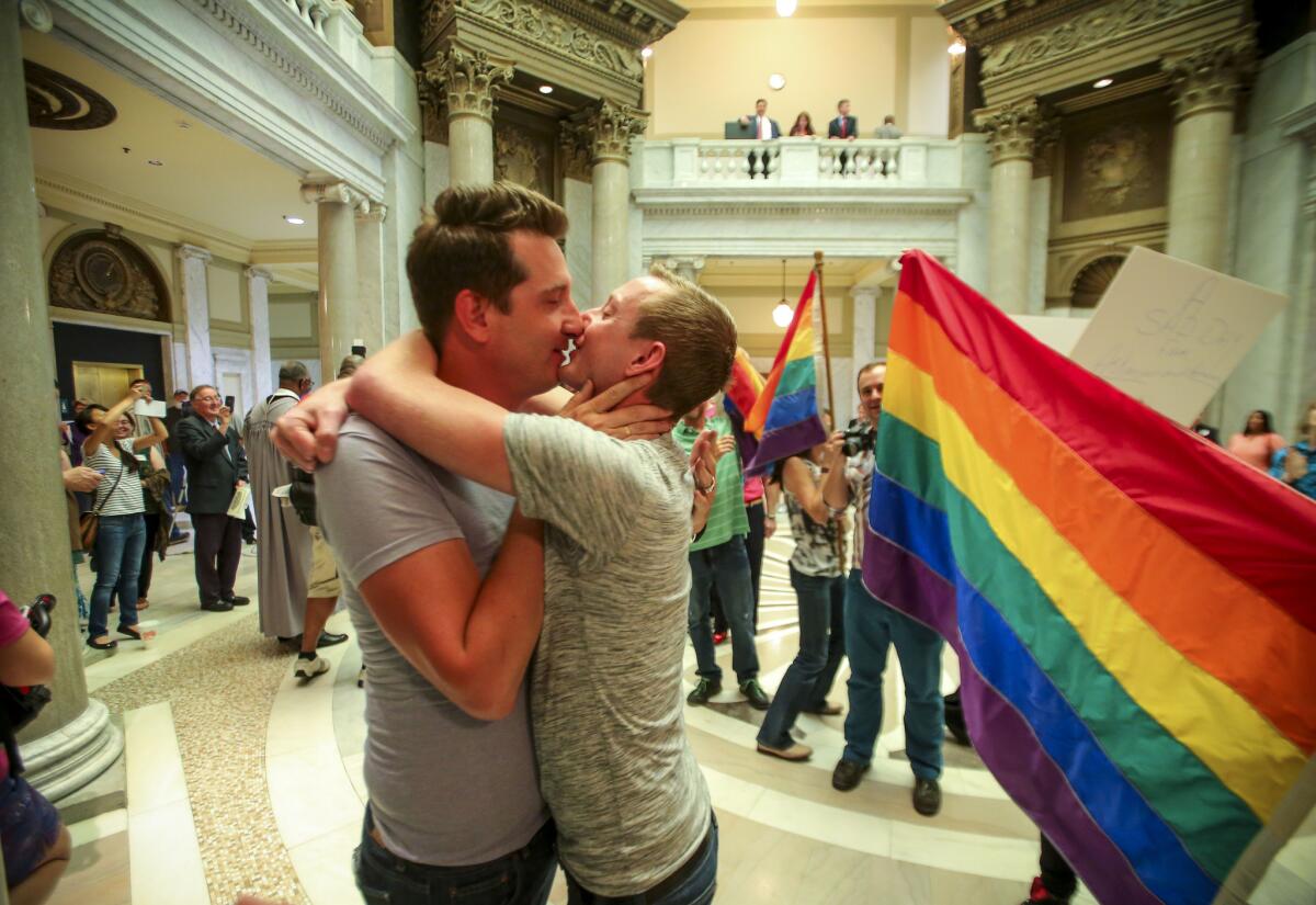 Brandon Armstrong, left, and Thomas Etheridge, both of Alexander, celebrate after being wed in the Pulaski County Courthouse in Little Rock, Ark., on May 12.