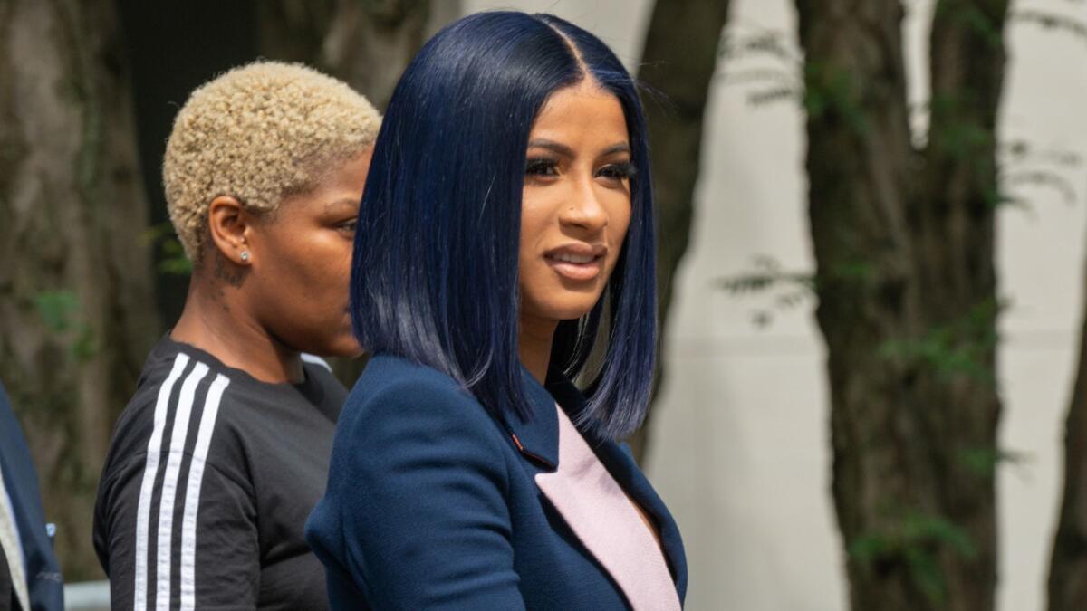Rapper Cardi B departs from court on Tuesday after being arraigned on assault charges at the Queens Criminal Court.