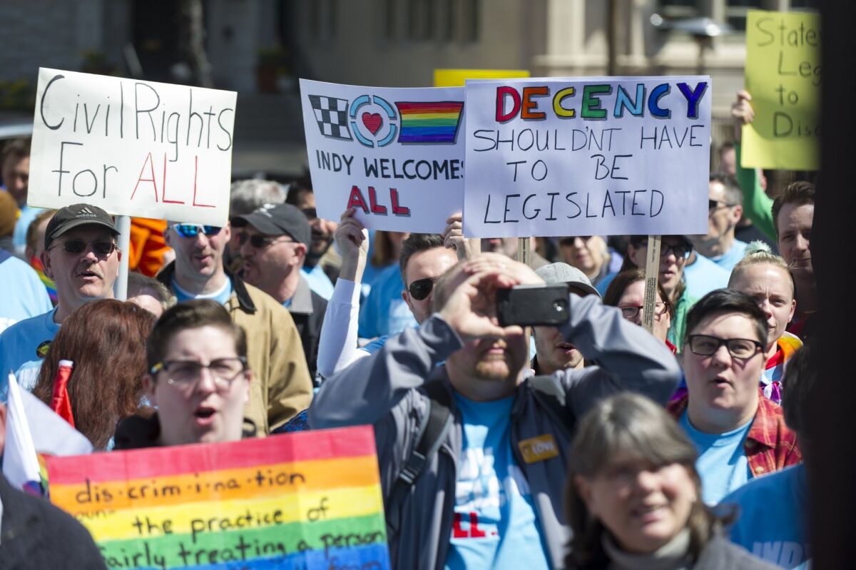 Opponents of Indiana Senate Bill 101, the Religious Freedom Restoration Act, gather for a demonstration in Indianapolis on April 4 to push for a state law that specifically bars discrimination based on sexual orientation or gender identity.