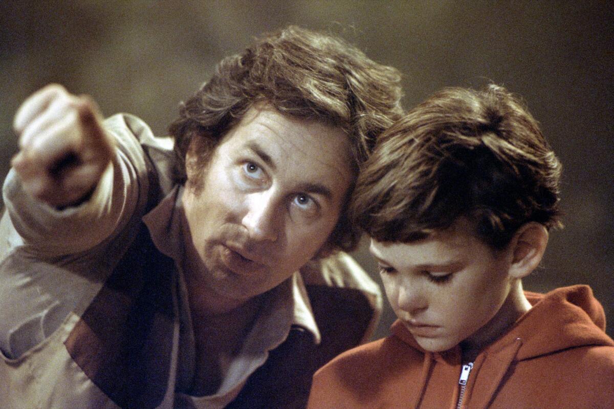 Spielberg directs Henry Thomas, right, on the set of "E.T. the Extra–Terrestrial (Bruce McBroom / Universal Studios)