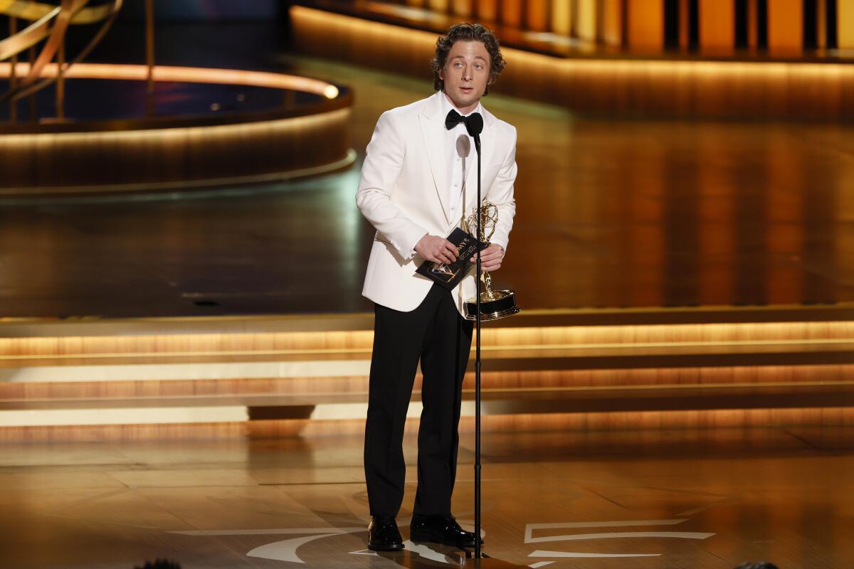 Jeremy Allen White gives an acceptance speech onstage at the Emmys.