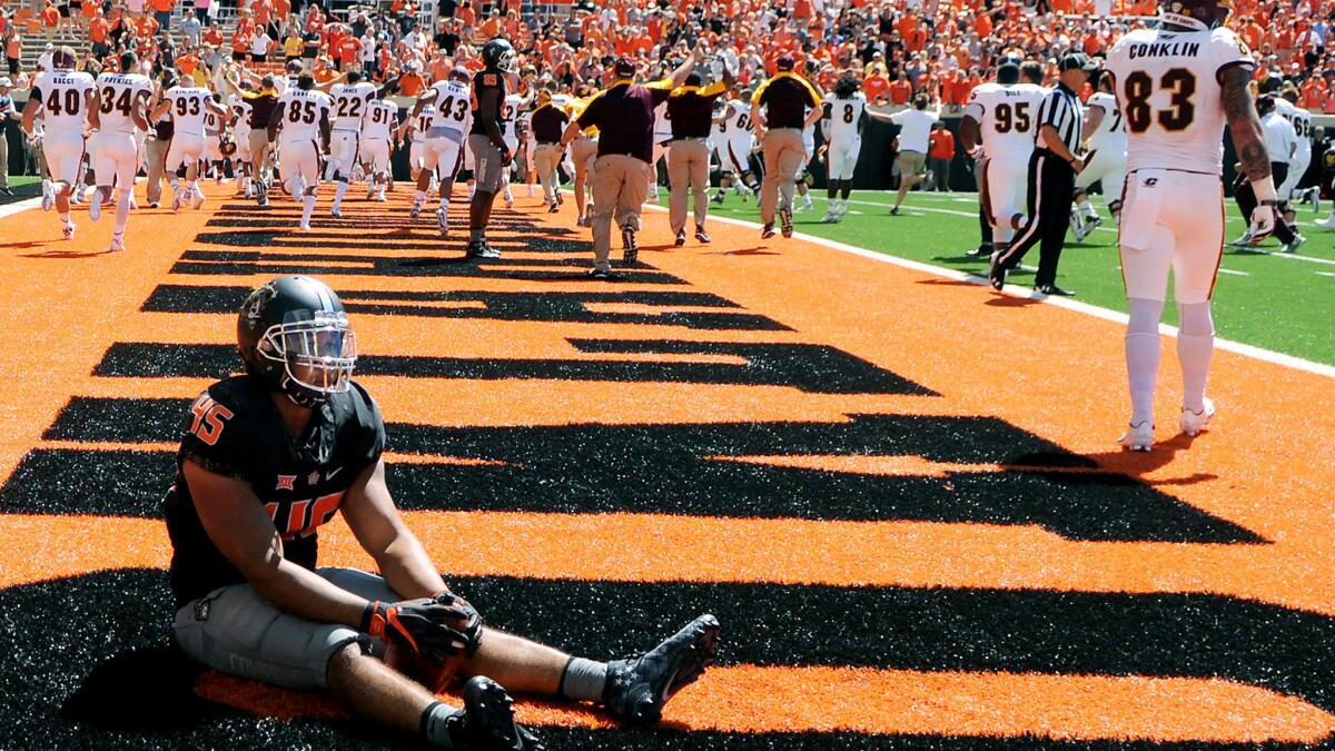 Oklahoma State linebacker Chad Whitener can't believe Central Michigan scored on the game's final play Saturday, a play that should not have happened.