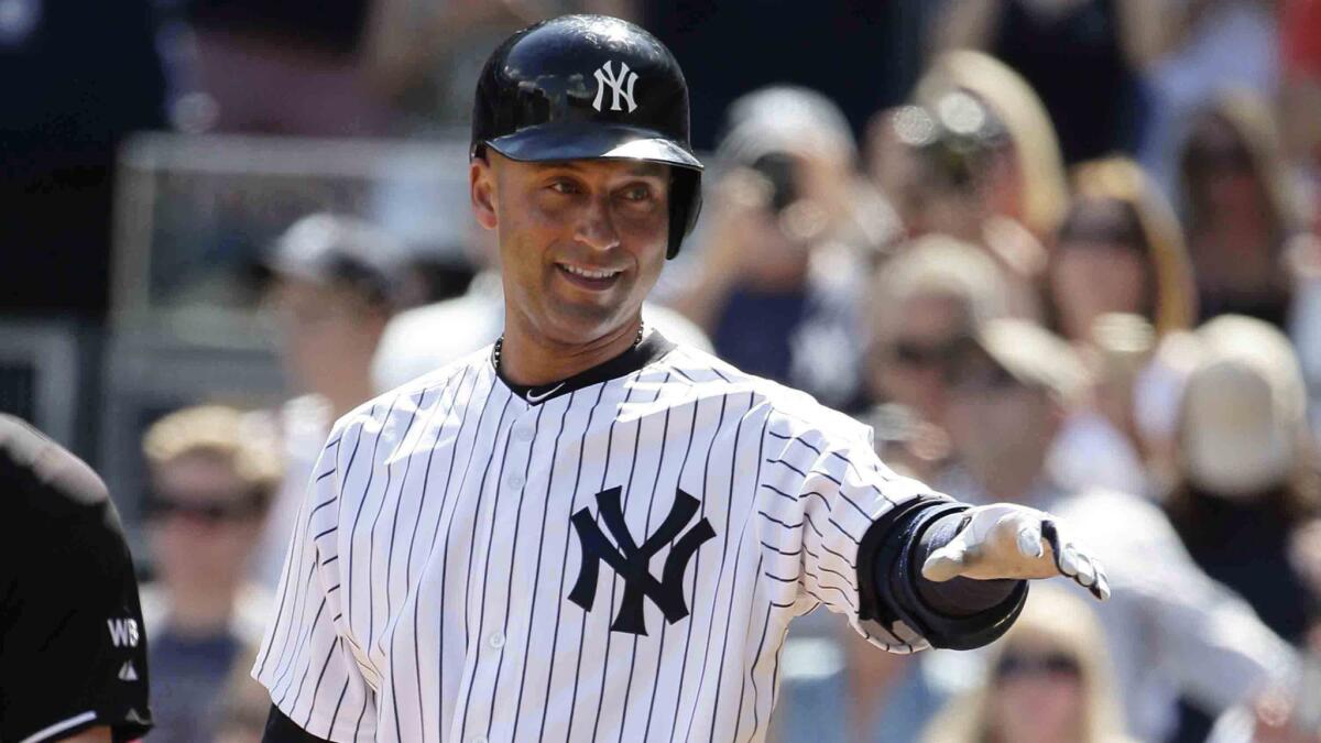 New York Yankees shortstop Derek Jeter smiles while acknowledging the Kansas City Royals dugout during Sunday's game.