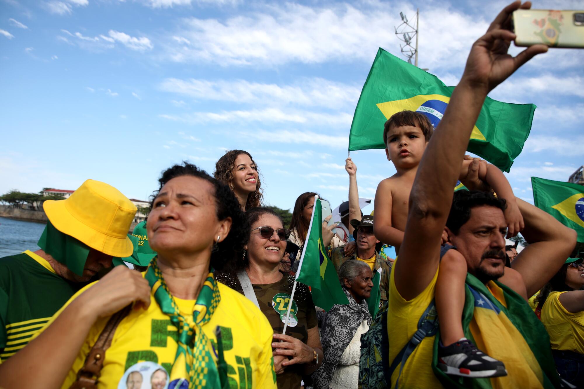 Supporters of President cheer during rally.