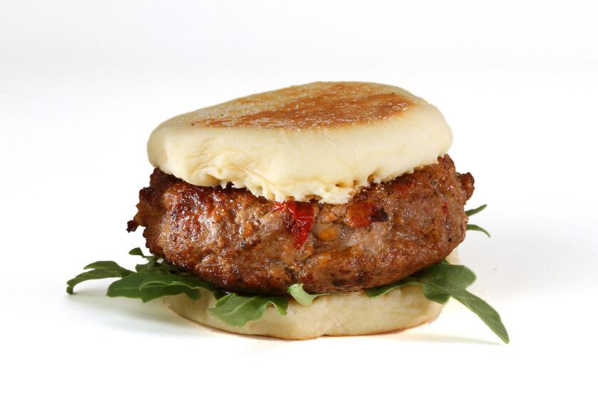 BLT&E burger -- with bacon, lettuce, tomato, sausage, rib-eye and quail eggs.