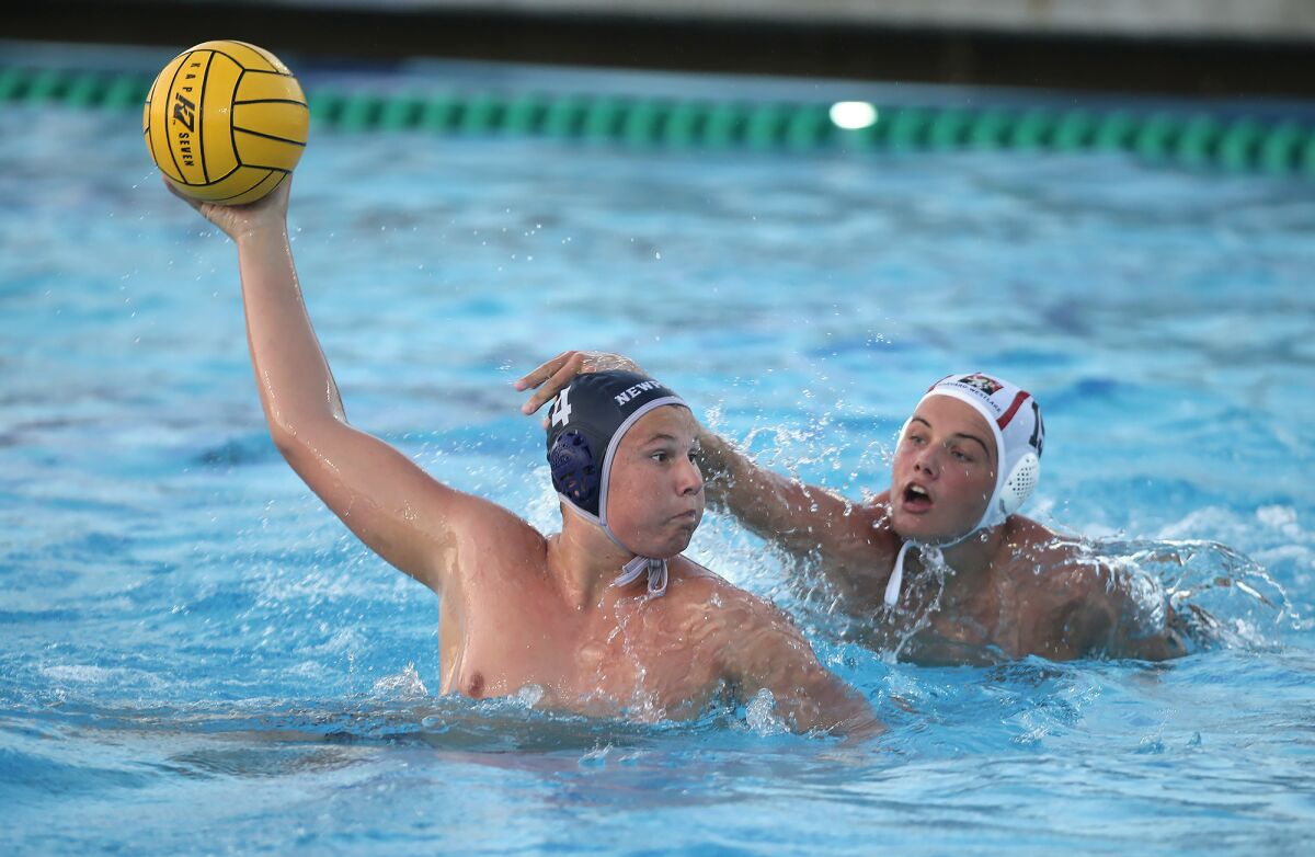 Newport Harbor's Eli Liechty shoots during water polo match against Harvard-Westlake.